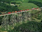 A CN train of double-stacked containers crosses the Salmon River Bridge near Grand Falls in New Brunswick.