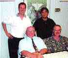 Above: Mitchell & Associates team. Back row, l to r: Ken Smith, Benny Szeto, (front row) Frank C. Mitchell, George Wright