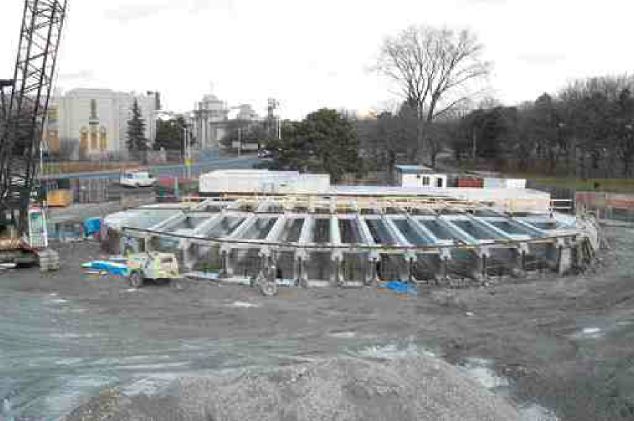 Above left: Roof structure being built over a deep storage shaft in Toronto's west end at Strachan Avenue. Above right: combined sewer outflow at Rat Creek in Edmonton.