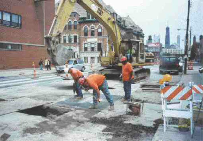 Road excavation in Chicago as part of a Canada-U.S. research project on utility cuts.