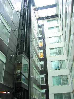 Glass covered walkway inserted to join the two buildings.