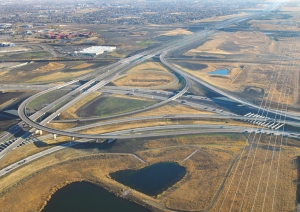 Above: junction of Anthony Henday Ring Road with Calgary Trail going south. Right: plan of ring road; purple and orange sections (SE and SW) are open, green (NW) opens in 2011, blue (NE) is in planning.