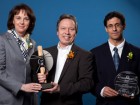 Jury chair Mme. Isabelle Courville of Hydro-Quebec hands an AICQ award to M. Michel Claisse of RSW and M. Hafid Bouzaiene of RSW, for the Boussiaba dam project in Algeria.