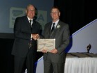 Neil Cumming of Levelton (right) receiving an award from Brian J. McQueen, chair of CSA Group