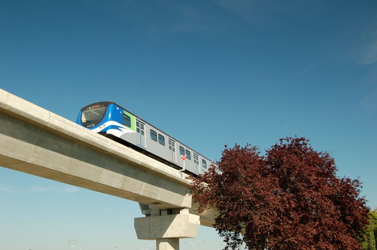 A train moves along an elevated guideway of the Canada Line near Vancouver International Airport. Photo courtesy SNC-Lavalin.