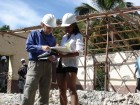 Shane Copp of Read Jones Christoffersen (left) talking to the contractor's architect at St. Joseph School in Embouchure, Haiti. The site has no roads or electricity and is a two hour hike from the nearest road.