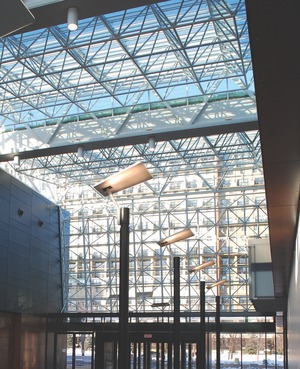 The atrium; the support structures for the glazed end facades are suspended elements with side and bottom supports.