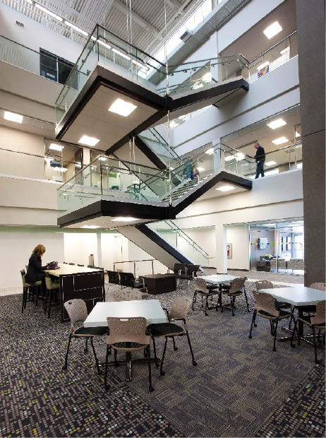 Above: inside the building's atrium. Right and inset: exterior views. All the different facets of the building work together to give energy efficiencies. Photograph courtesy Kindrachuk Agrey Architecture.