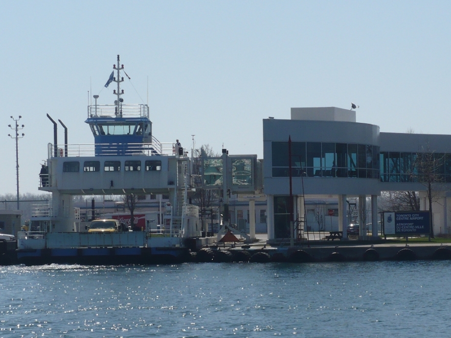 Ferry to the Toronto Island. The ferry ride is less than two minutes, but sometimes passengers have to line up for much longer to get on the crowded decks.   Photo Secondarywaltz, Wikimedia Commons.