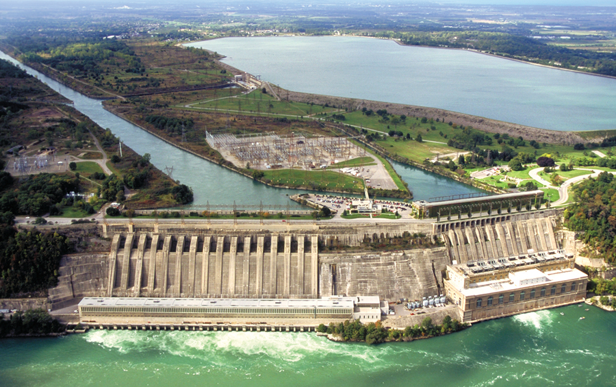 The Sir Adam Beck Generating Station near Niagara Falls, Ontario has a pumped power facility dating from 1957. It is visible in the photo to the left of the reservoir, behind the concrete penstocks in the foreground. Image courtesy Ontario Power Generation.