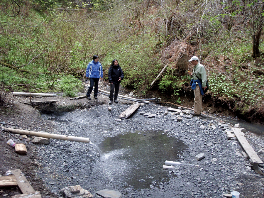 Freda Leong (centre) checking out a geothermal water source on Gitwinksihlkw lands in B.C.