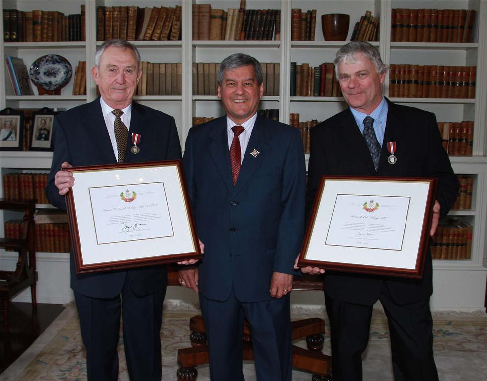 Ed Smith, P.Eng., (left) and Hollis Cole, P.Eng., (right) receive the Queen Elizabeth II Diamond Jubilee Medal and certificate from New Brunswick Lieutenant Governor Graydon Nicholas at Government House in Fredericton.