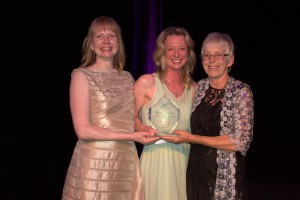 Anne Poschmann (right) gives the Chair's Award to TWICE Committee founding chair Kristen Poff (centre) and Alana Gauthier, president of ACEC Manitoba. 